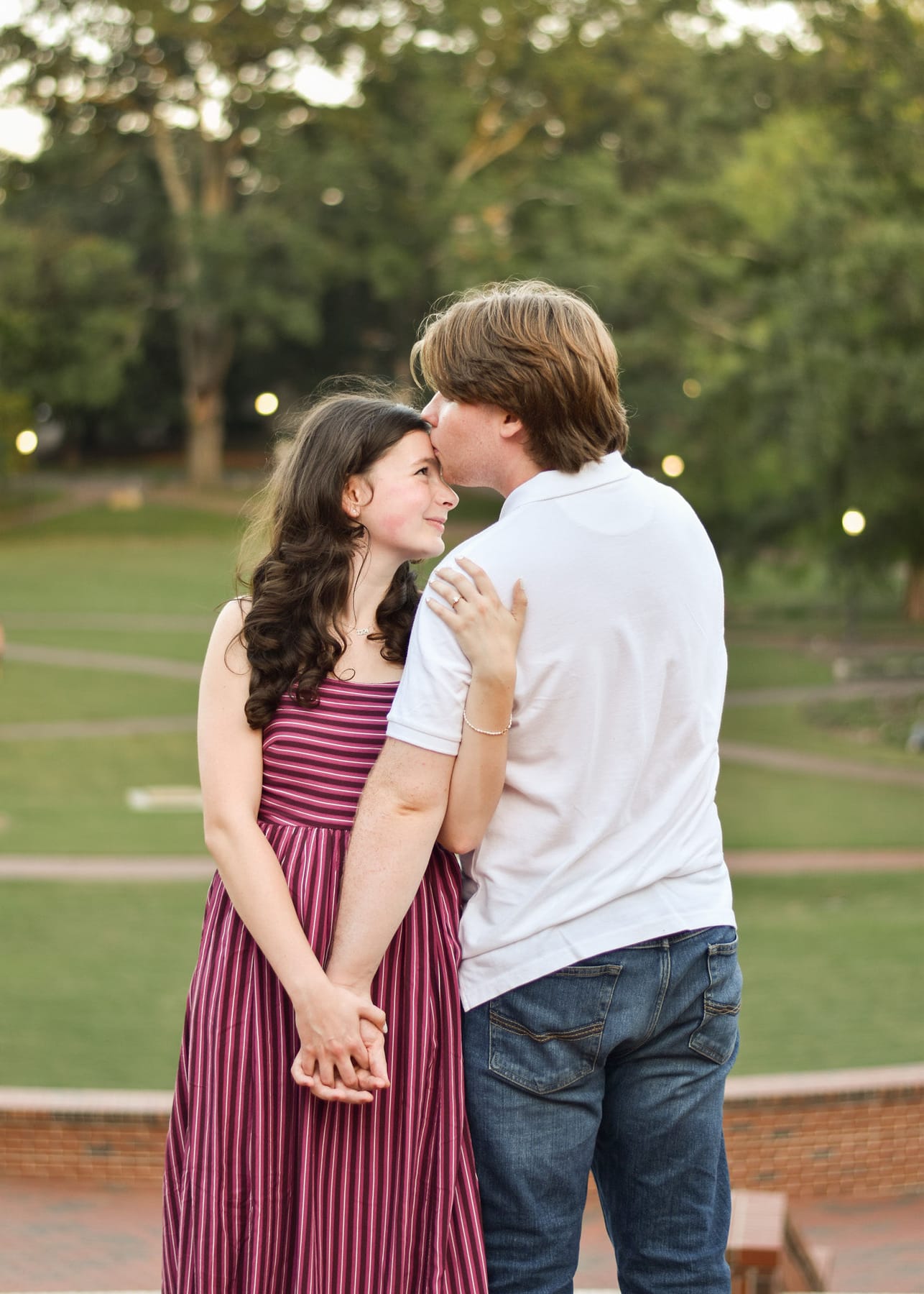 Stephanie and Robert holding hands on the lawn